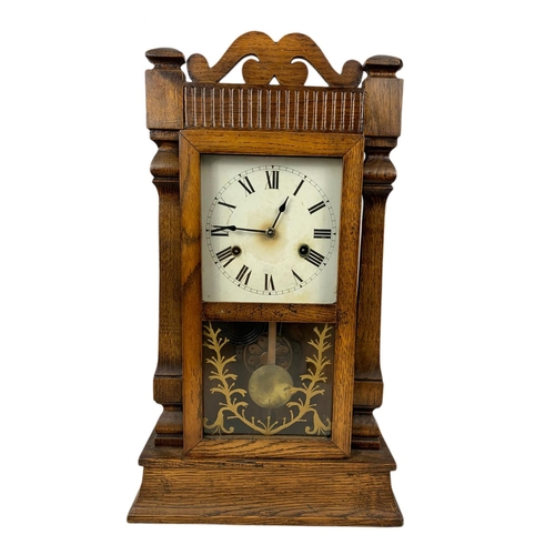 182 - Late 19th century oak case mantle clock . With pendulum. 55.5cm