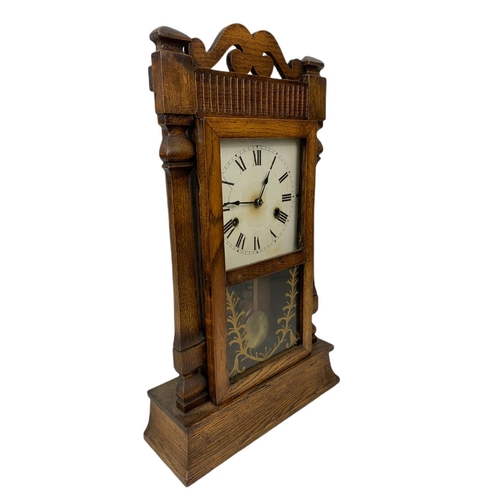 182 - Late 19th century oak case mantle clock . With pendulum. 55.5cm