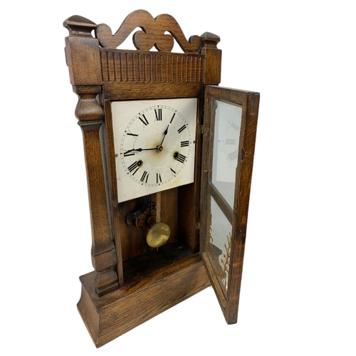 182 - Late 19th century oak case mantle clock . With pendulum. 55.5cm