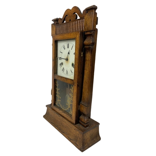 182 - Late 19th century oak case mantle clock . With pendulum. 55.5cm