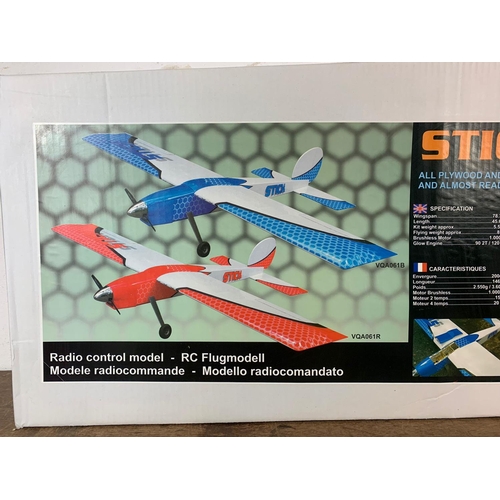 145 - Giant Stick Sport 90 radio control plane in box. Unopened box measures 123cm