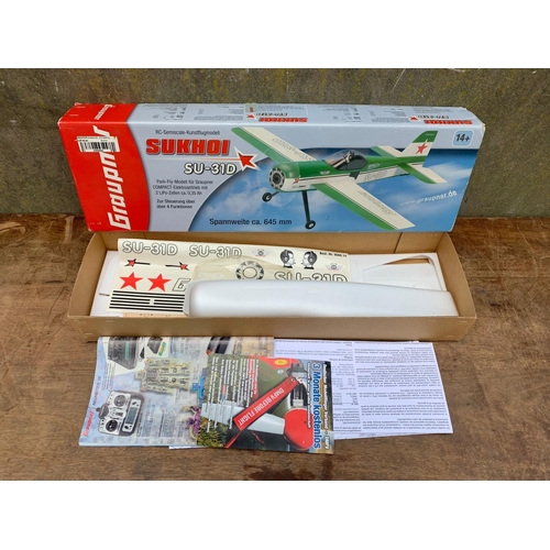 26 - Graupner Sukhoi SU-31D plane in box. RC-Semiscale-Kunstflugmodell. Box measures 68 x 20 x 9cm