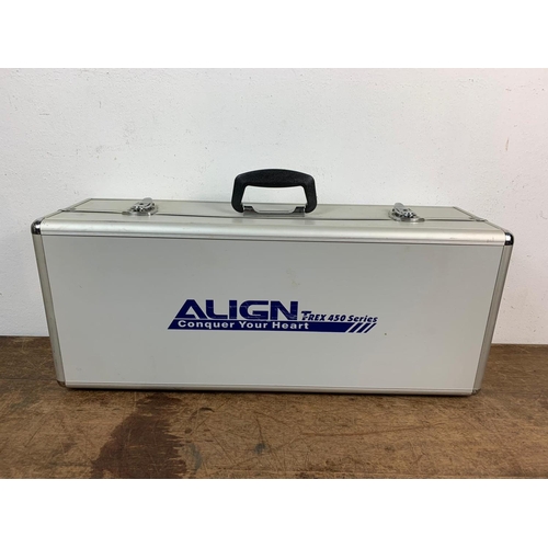 34 - Align Trex 450 Series remote control helicopters in case. Case measures 70 x 28cm