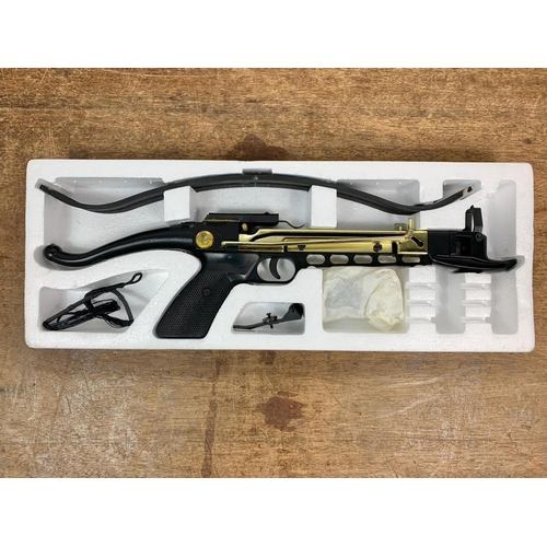 50 - Self Cocking Pistol Crossbow in box. Box measures 52.5cm