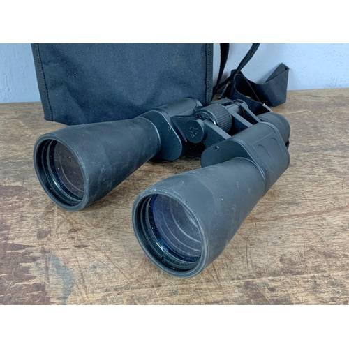 76 - 2 pair of binoculars in cases. Rocktrail and Luxon. Largest pair 19.5 x 23.5cm