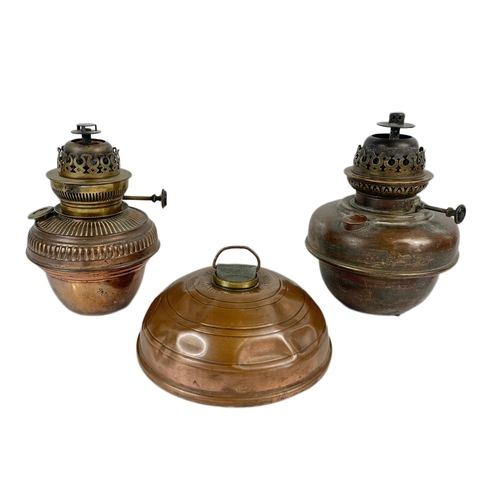158 - 2 Victorian oil lamp bases with an early 20th century copper hot water container