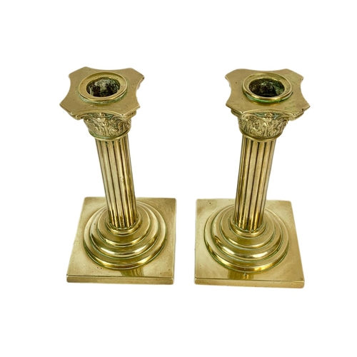 210 - Pair of Victorian brass Corinthian style candle sticks. 18cm