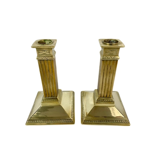 212 - Pair of Victorian brass candle sticks. 15cm