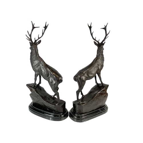 24 - Pair of bronze stags, signed J. Moigniez, 73.5cm