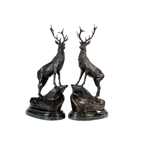 24 - Pair of bronze stags, signed J. Moigniez, 73.5cm