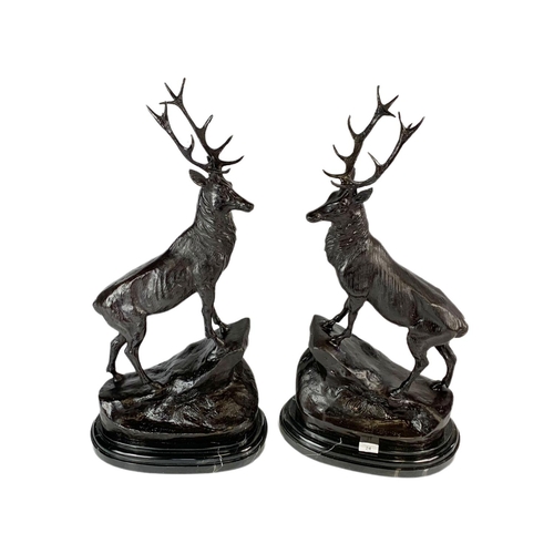 24 - Pair of bronze stags, signed J. Moigniez, 73.5cm