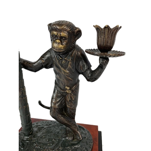 25 - Bronze monkey candle holder, 49cm