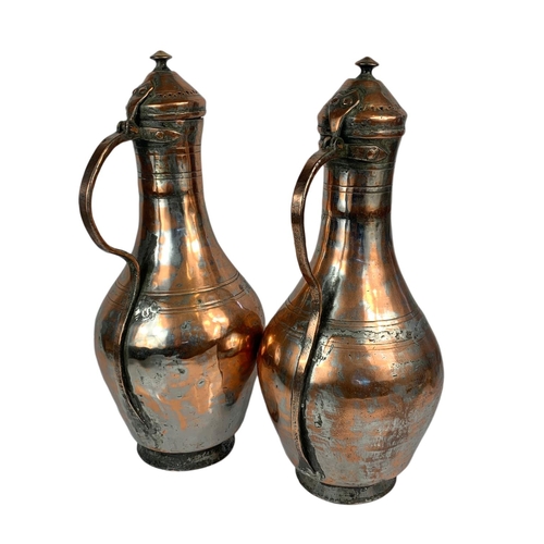 44 - Pair of 19th century style copper jugs. 51cm