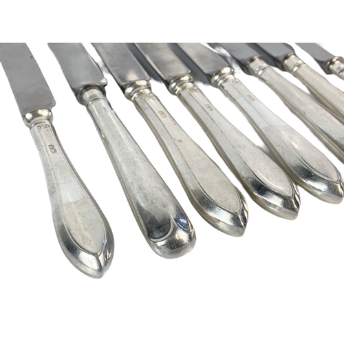 671 - 8 silver handled knives