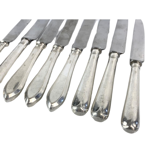 671 - 8 silver handled knives