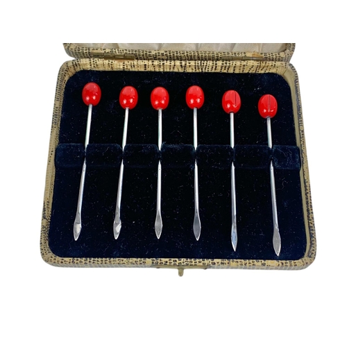 677 - Set of sterling silver cocktail sticks in case