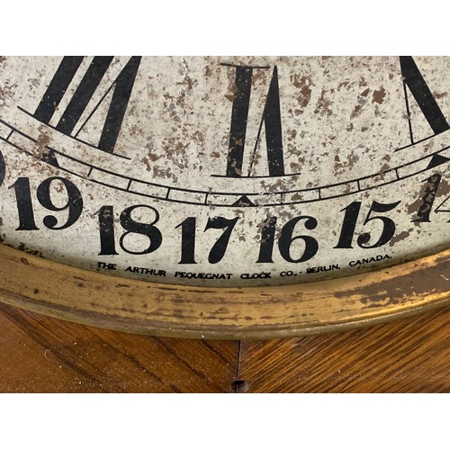 354 - Early 20th century oak case wall clock by Arthur Pequegnat. Circa 1910. 39 x 91cm