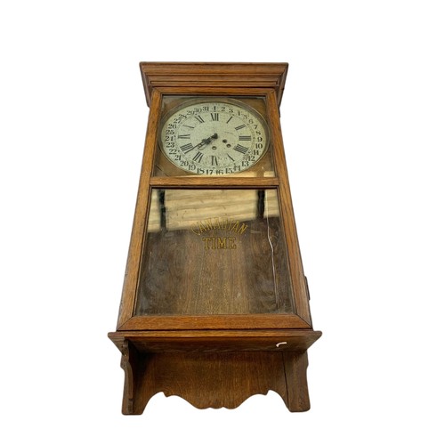 354 - Early 20th century oak case wall clock by Arthur Pequegnat. Circa 1910. 39 x 91cm