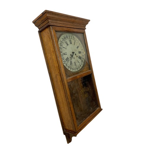 354 - Early 20th century oak case wall clock by Arthur Pequegnat. Circa 1910. 39 x 91cm