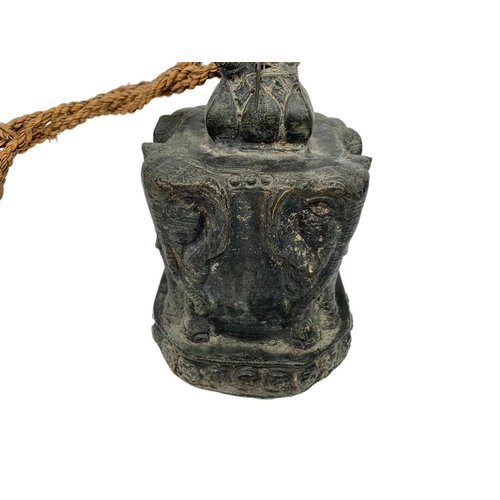 245 - 19th century Burmese brass bell, 17cm