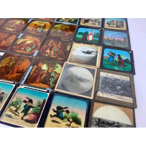 266 - Large quantity of early 20th century slides. Novelty, military and religious themes etc