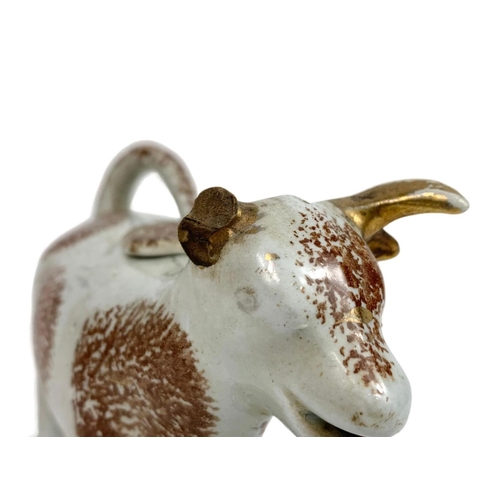 509 - Victorian cream jug in the shape of a cow ,15cm x 12cm