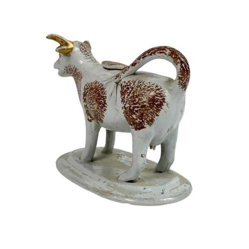 509 - Victorian cream jug in the shape of a cow ,15cm x 12cm