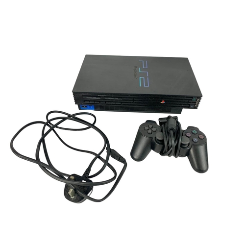128 - PS4 and PS1 with games and controllers. PS1 controller unopened