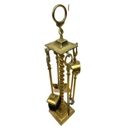 278 - Victorian brass companion set, 58cm