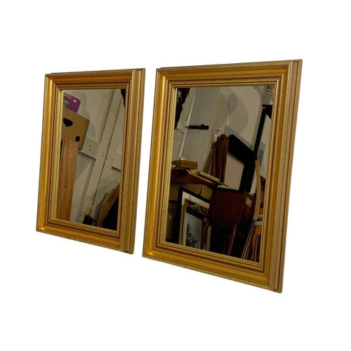 303 - Pair of gilt framed mirrors. 37 x 50cm.