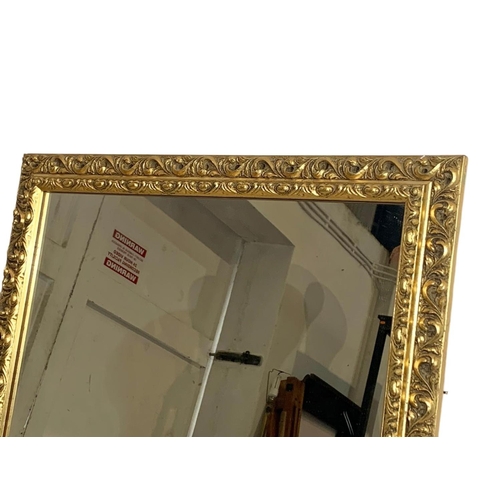 322 - Vintage ornate gilt framed mirror. 53 x 99cm