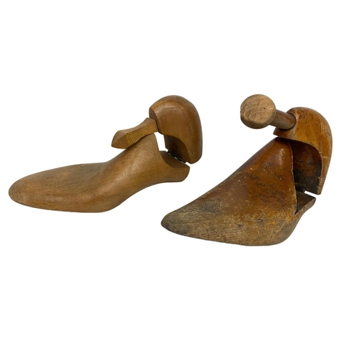 325 - 3 vintage wooden shoe moulds and a vintage brass bell.