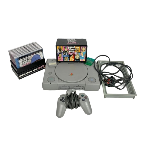 374 - PS1 with controller and Grand Theft Auto Vice City soundtrack box set.