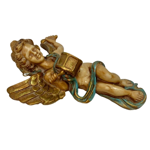 550 - 2 cherub plaques. 19cm