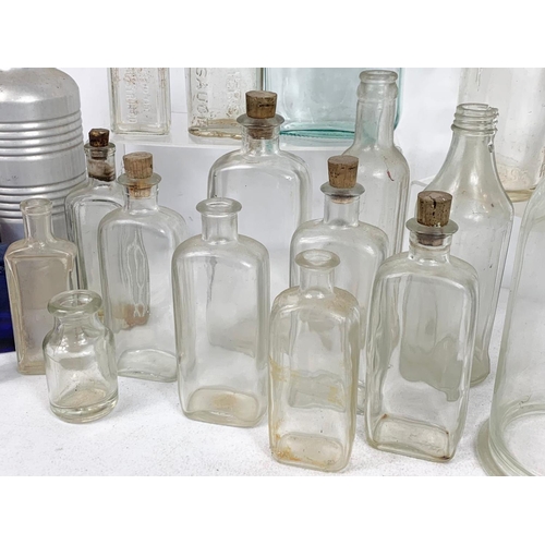 585 - Quantity of early 20th century glass bottles and jars