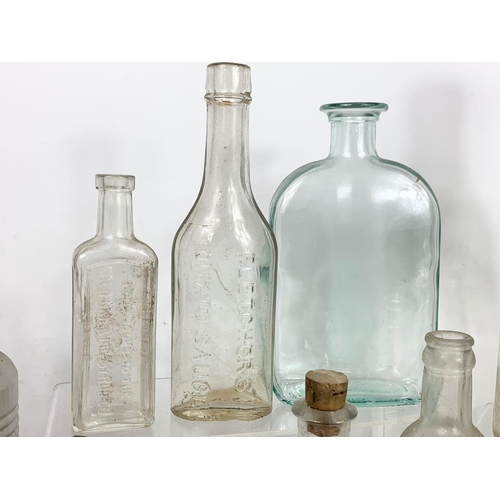 585 - Quantity of early 20th century glass bottles and jars