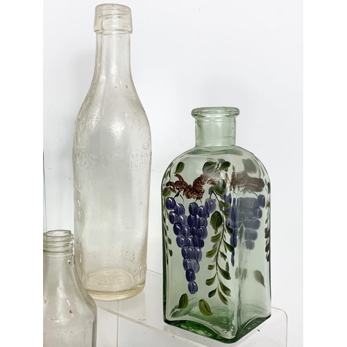 585 - Quantity of early 20th century glass bottles and jars