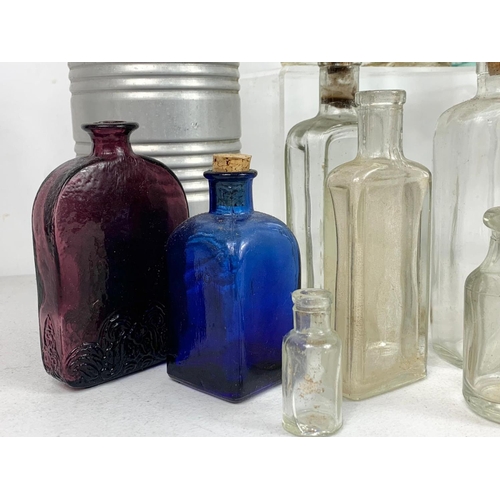 585 - Quantity of early 20th century glass bottles and jars