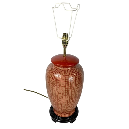 622 - Large decorative pottery lamp on wooden base. 64cm