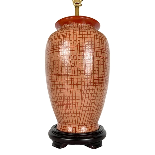 622 - Large decorative pottery lamp on wooden base. 64cm