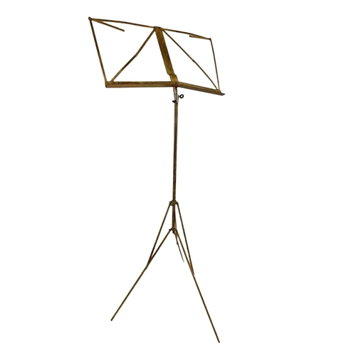 633 - Early 20th century brass music stand. 101cm