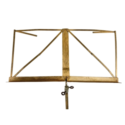 633 - Early 20th century brass music stand. 101cm