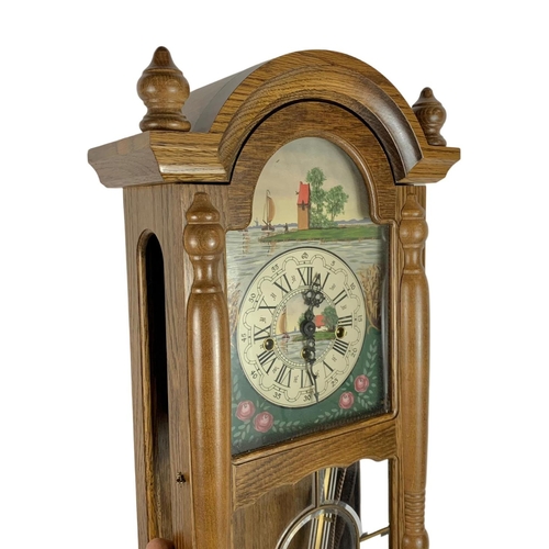 759 - Victorian style wall clock. With key and pendulum. 79cm.