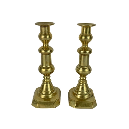 762 - Pair of Victorian brass candlesticks. 27cm.