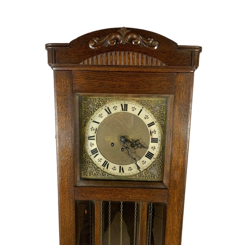 1203 - Early 20th century walnut long case clock. Circa 1930’s. 42/21/172cn.