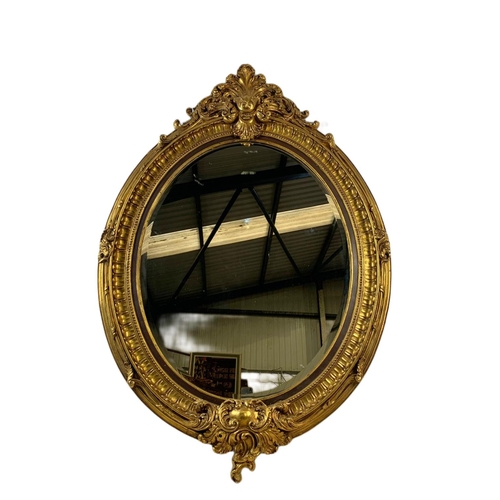 1204 - Large Victorian style ornate gilt framed mirror. 104 x 151cm