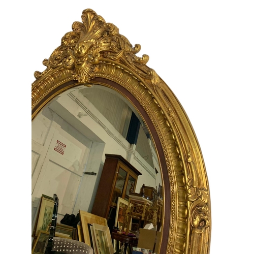 1204 - Large Victorian style ornate gilt framed mirror. 104 x 151cm