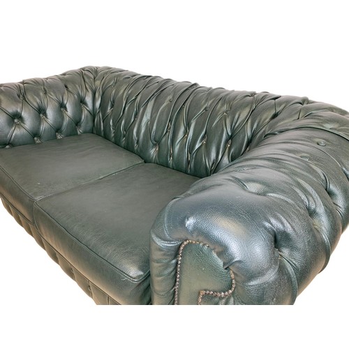 1213 - Faux leather Chesterfield 2 seater sofa.