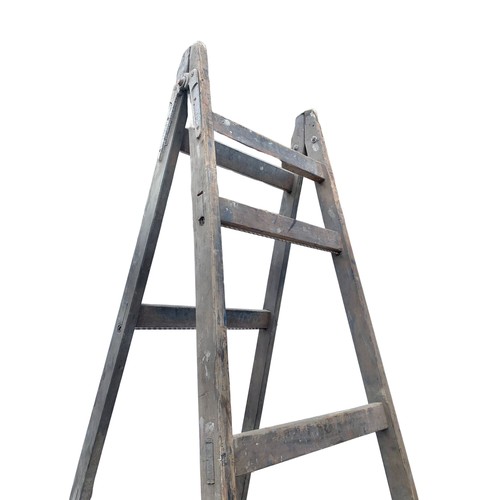 92a - Large early 20th century trestle stand, 303cm