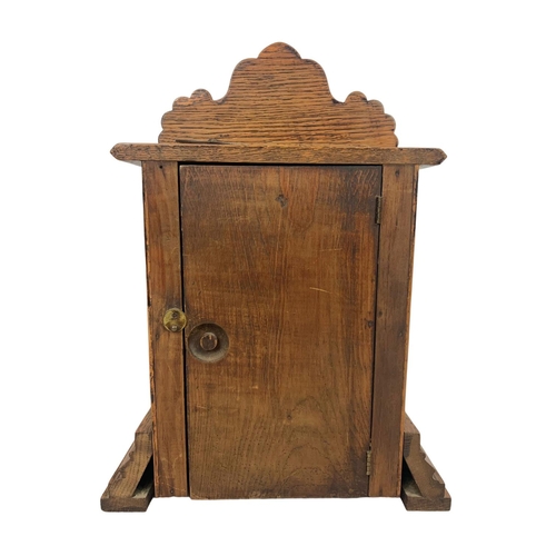 31 - Late Victorian Ansonia Clock Company oak clock. With key and pendulum. 28.5 x 14 x 40cm.